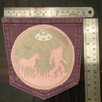 Hot Pocket BELIEVE Purple Pocket Denim Patch BIGFOOT Unicorn UFO pink and silver on wheat background Appliques & Patches